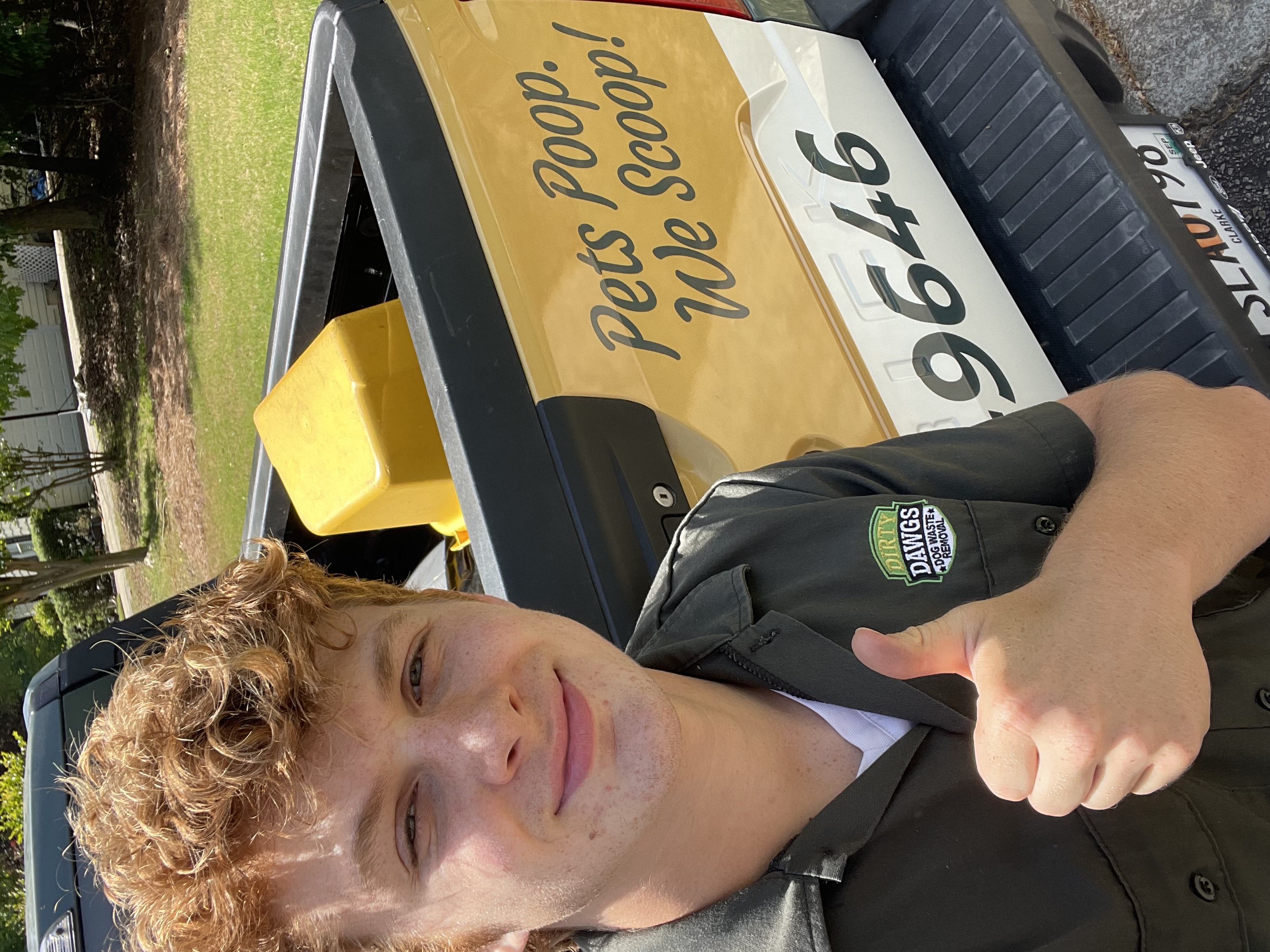 Dirty Dawgs technician giving thumbs up